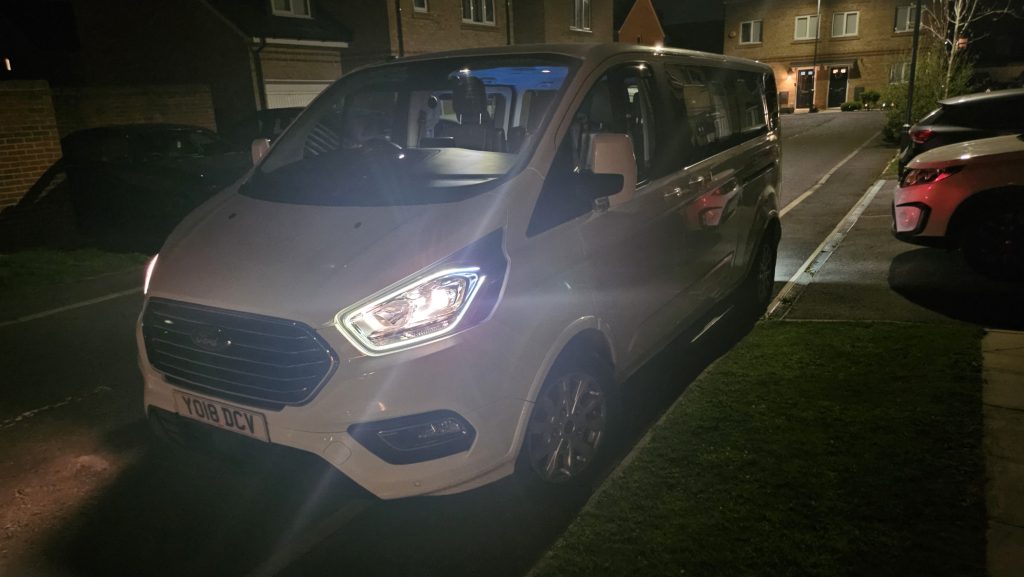 white minibus at night in liverpool